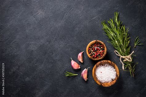 Food cooking background with herbs and spices on black. Stock Photo ...