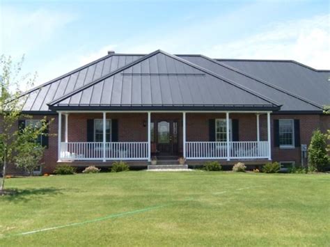 Dark grey painted roof with red brick | Metal roof houses, Tin roof ...