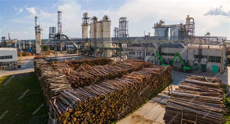 Premium Photo | Aerial view of wood processing factory with stacks of ...