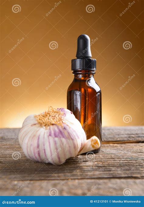 Garlic extract stock image. Image of olive, liquid, bottle - 41213101