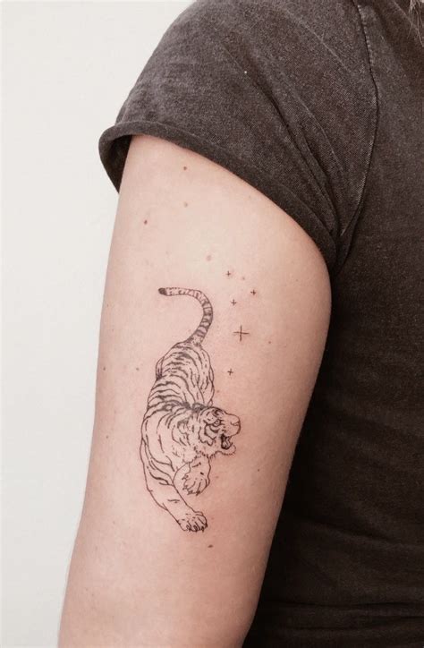 Tiger tattoo realistic | Homemade tattoos, Tattoos for guys, Tiger tattoo small