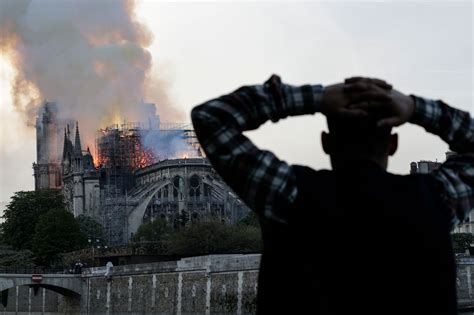 Scenes of Notre Dame Cathedral in flames