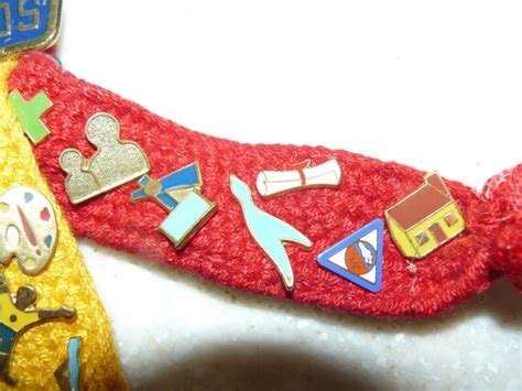 Webelos Ribbons and Badge pins from the 1980's. 21 brass