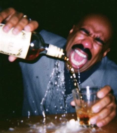 a man drinking from a bottle and pouring it into a glass