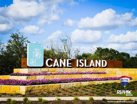 The stunning entrance into Cane Island in Katy, Texas is only the beginning at this one of a ...