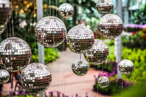 Disco Balls, Mirror Balls Hanging Outside In The Garden. Bright ...