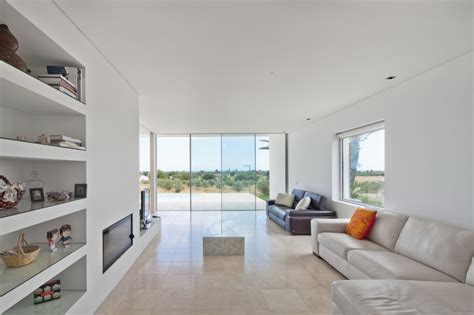 Minimalist White House with Glass Walkway in Olive Grove