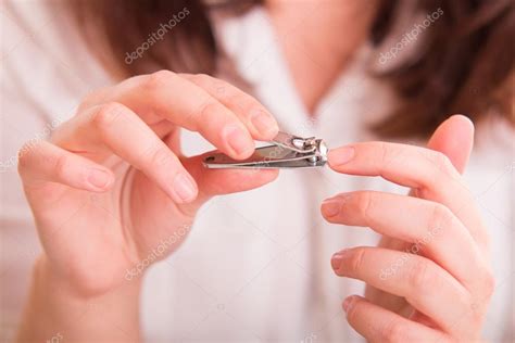 Woman cutting nails — Stock Photo © MichalLudwiczak #82579570