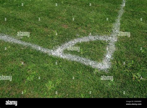 White Corner marking on a green field Stock Photo - Alamy