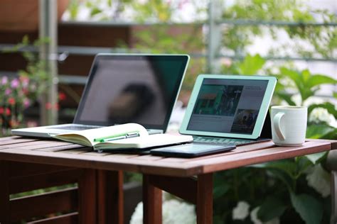 Woman with laptop lying down in bed · Free Stock Photo