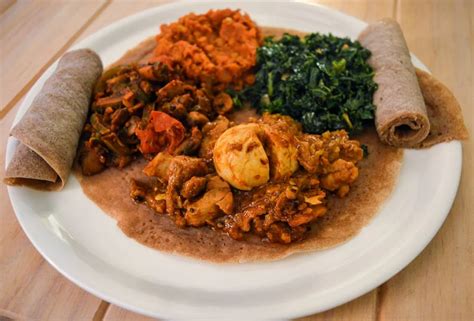 [Homemade] Injera with misir wat, doro wat, gomen, and ingudai tibs ...