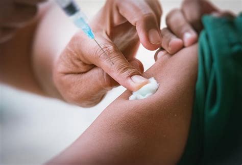 Child getting typhoid shot