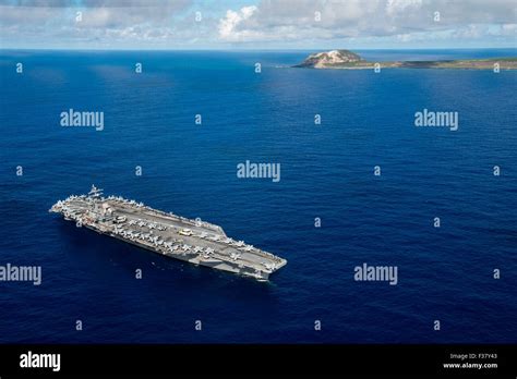 US Navy Nimitz-class nuclear aircraft carrier USS Ronald Reagan pauses ...