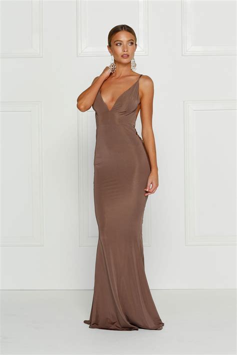 brown backless dress with a plunging neckline in a stretch fabric. Fitted formal dress prom dre ...