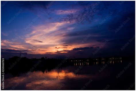 sunset over the Hussain sagar lake Stock Photo | Adobe Stock