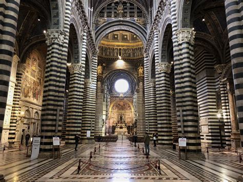 The striped marble columns of Siena Cathedral create a striking appearance. Groundbreaking 1196 ...