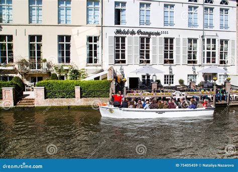 Boat Tour Station with Tourists at Canal in Bruges, Belgium Editorial ...