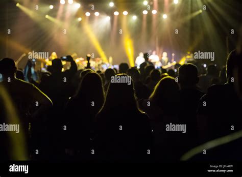 Crowd at concert and blurred stage lights Stock Photo - Alamy