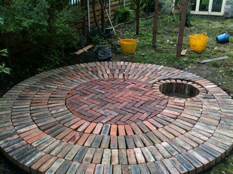 brick firepit | Reclaimed brick patio, Outdoor fire pit, Fire pit backyard