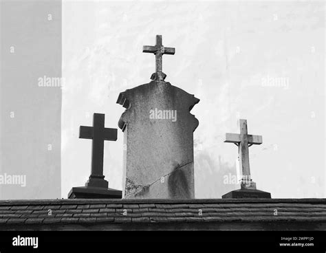 Old gravestones with crosses at a catholic church near garmisch partenkirchen hi-res stock ...