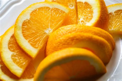 Close-up of fresh orange slices in plate - StockFreedom - Premium Stock ...
