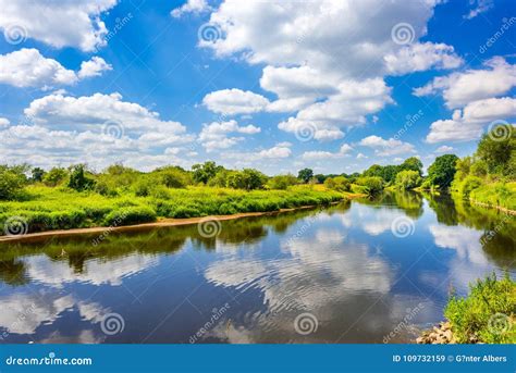 Clouds Reflecting in Ems River, Emsland, Germany Stock Image - Image of bank, blue: 109732159