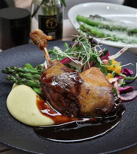 Confit Duck - Crispy duck leg with potato puree grilled asparagus red ...