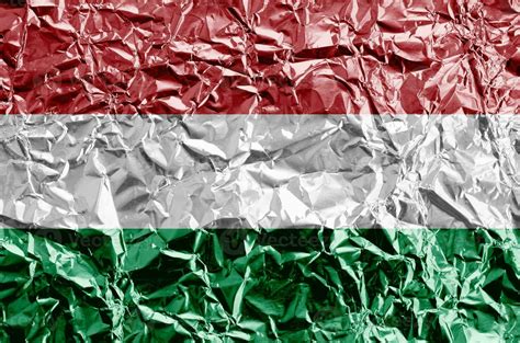 Hungary flag depicted in paint colors on shiny crumpled aluminium foil ...