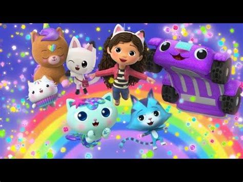 a group of cartoon characters standing on top of a rainbow colored ...