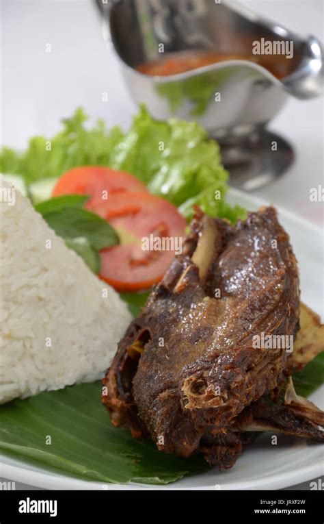 Indonesia Roasted Duck, bebek bakar serve with chili paste, sambal Stock Photo - Alamy