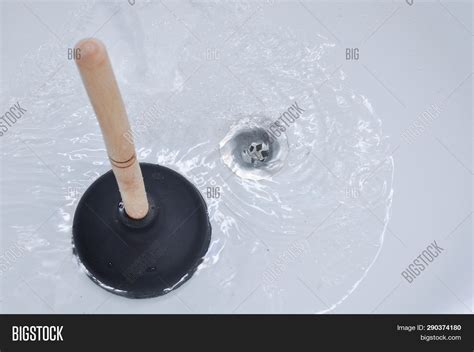 Plunger Clogged Bath Image & Photo (Free Trial) | Bigstock