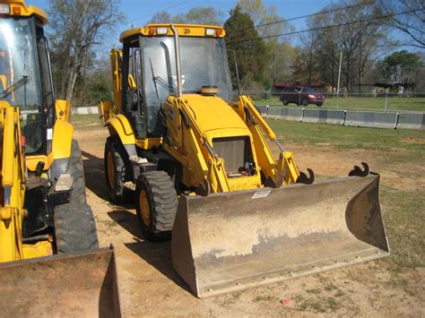 JCB 214 4X4 LOADER BACKHOE - J.M. Wood Auction Company, Inc.