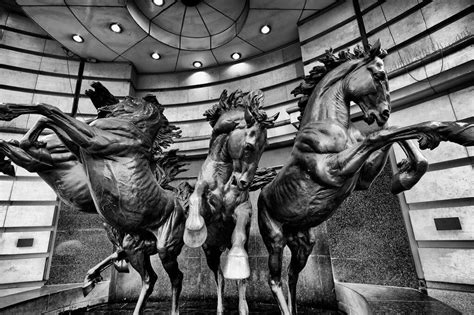 The Four Bronze Horses of Helios statue was created by sculptor Rudy Weller in 1992. It is sited ...