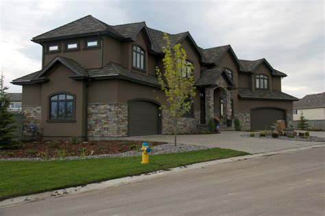 {not quite this dark} dark brown stucco homes | The Stucco & Stone work on this home in McLuhan ...