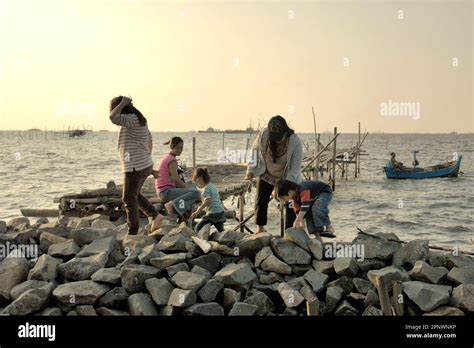 Women and children having a recreation time on a beach in Marunda ...