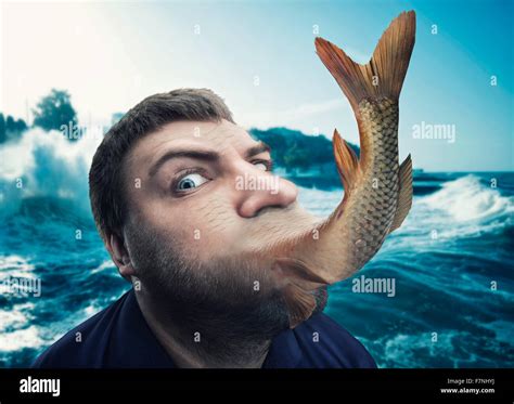 Man eating fish Stock Photo - Alamy