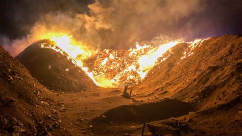 Georgetown firefighters working to stop flames at Texas Disposal Systems waste station | KXAN Austin