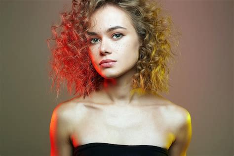 Premium Photo | Beautiful woman in colorful lights