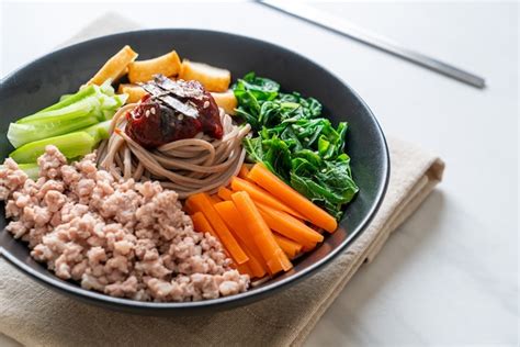 Premium Photo | Korean spicy cold noodles - bibim makguksu or bibim guksu - korean food style