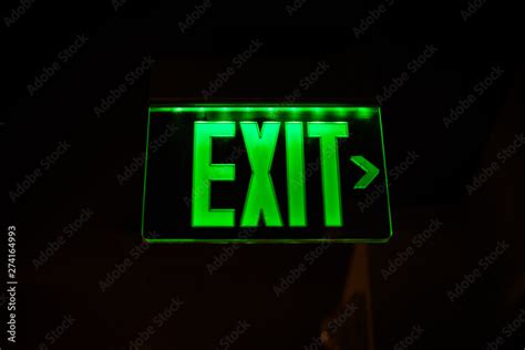 green exit sign neon Stock Photo | Adobe Stock