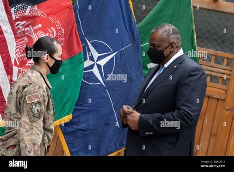 Secretary of Defense Lloyd J. Austin presents his coin to recognize ...