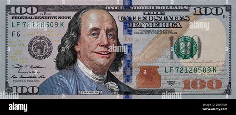 Benjamin Franklin smiling on 100 dollar banknote for design purpose ...