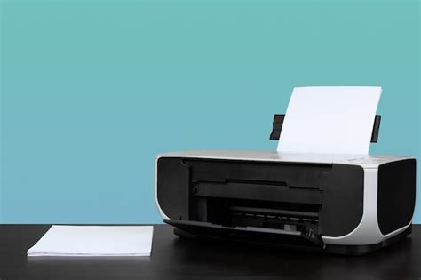 Premium Photo | Home laser printer on desk against green background