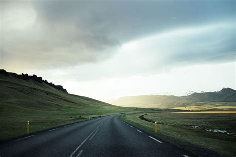 HD wallpaper: white line open road under cloudy skies, black asphalt ...