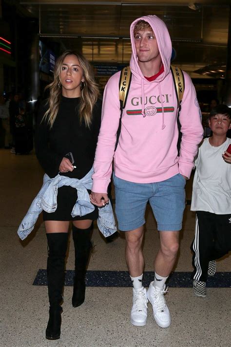 chloe bennet and logan paul seen arriving at lax airport in los angeles ...