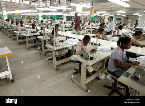 Workers on assembly line in an apparel factory Stock Photo - Alamy