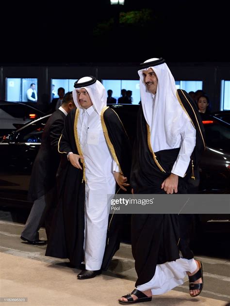 Sheikh Tamim bin Hamad Al Thani of Qatar (R) arrives to attend the Court Banquet at the Imperial ...