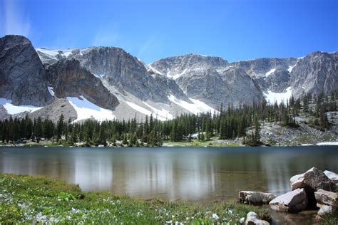 Mirror Lake, Snowy Mountain Range, WY - Overlooking Mirror Lake onto the quartzite cliffs of the ...