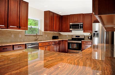 high gloss faux wood block counters; dark cherry cabinets; stainless steel appliances; full ...