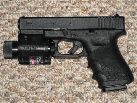 File:Glock Model 23 with tactical light and laser sight..jpg ...